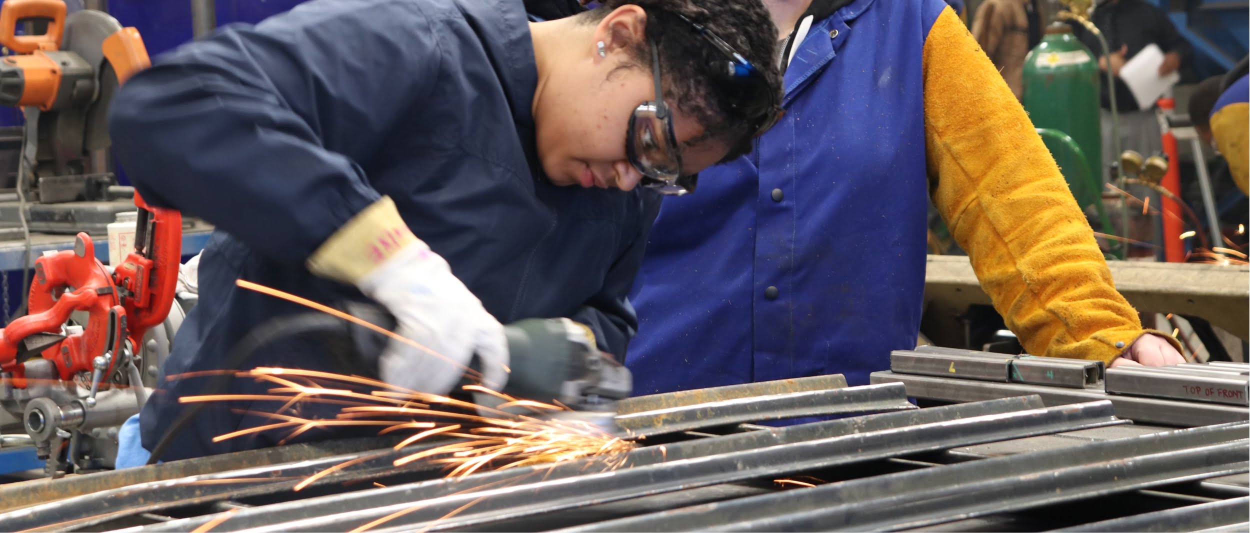 girl fabricating metal